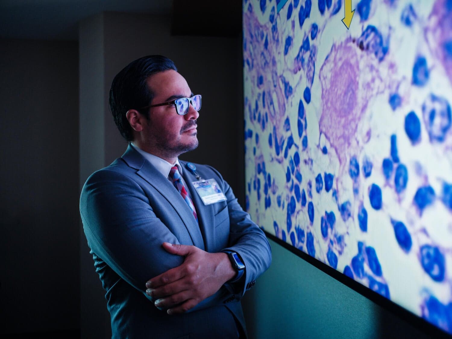 Mayo Clinic Physician reviewing a microscopy image.